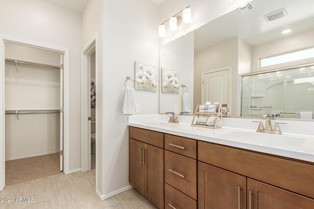 18197 W Cielo Grande Ave, Surprise, AZ 85387 - bathroom featuring a shower with shower door and vanity
