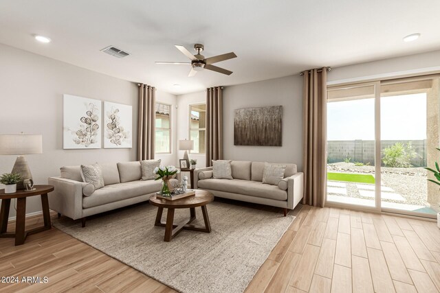 18197 W Cielo Grande Ave, Surprise, AZ 85387 - living room featuring light wood-type flooring and ceiling fan