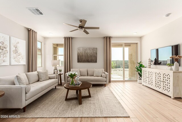 18197 W Cielo Grande Ave, Surprise, AZ 85387 - living room with ceiling fan and light wood-type flooring