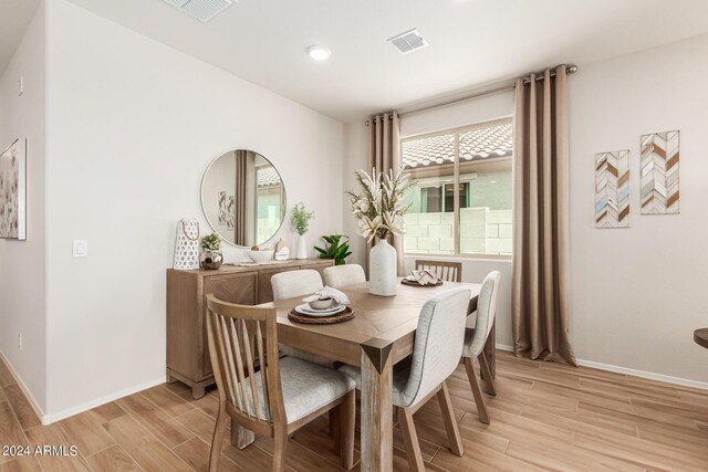 18197 W Cielo Grande Ave, Surprise, AZ 85387 - dining space with light hardwood / wood-style floors