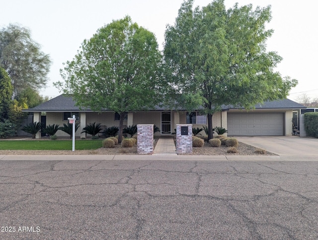 view of front of property featuring driveway and an attached garage