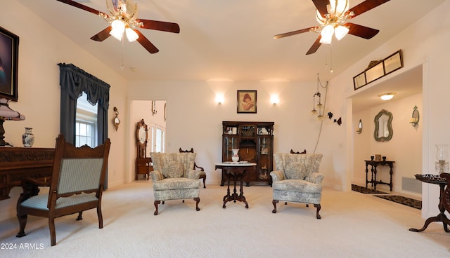 sitting room with light carpet and ceiling fan