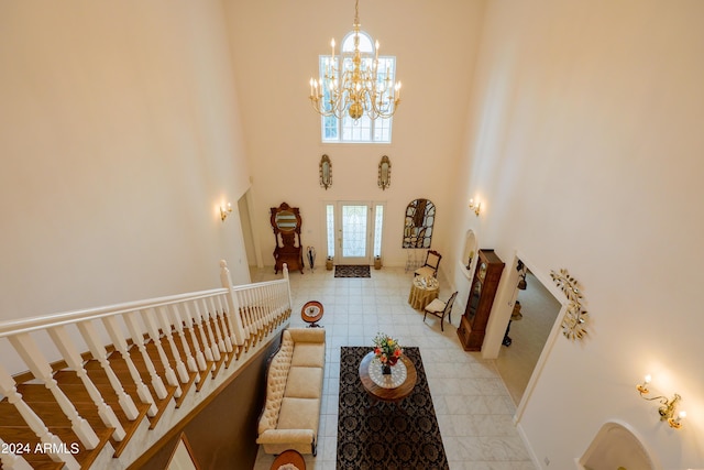 entrance foyer with an inviting chandelier and a towering ceiling