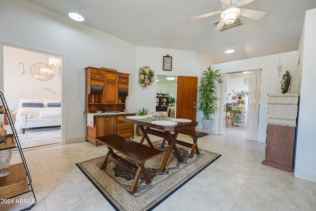 tiled dining area with ceiling fan