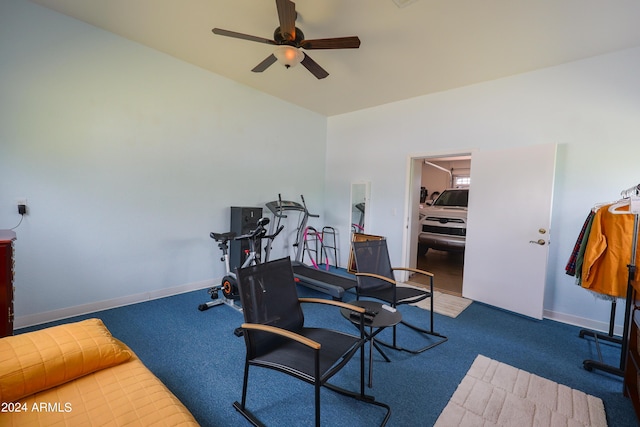 carpeted home office featuring ceiling fan