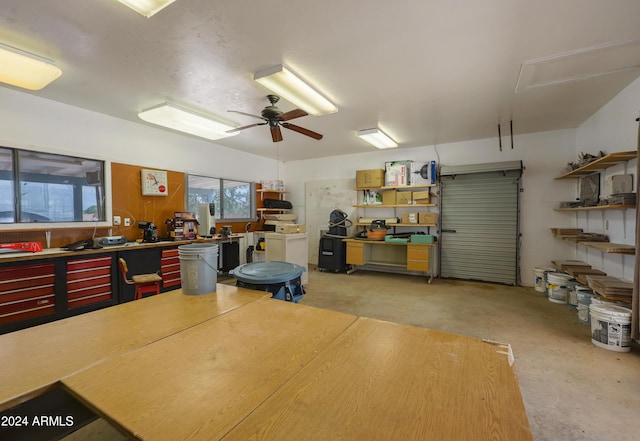 garage featuring a workshop area and ceiling fan