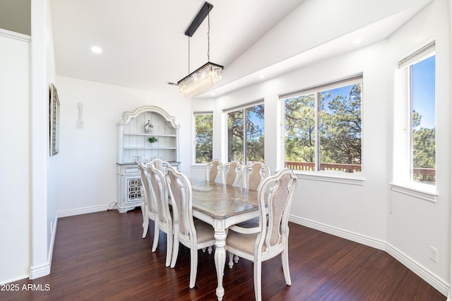 dining room featuring lofted ceiling, baseboards, dark wood-style flooring, and recessed lighting