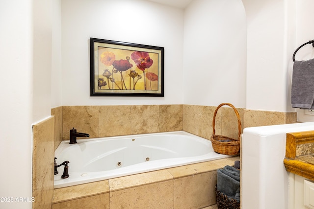 bathroom featuring a tub with jets