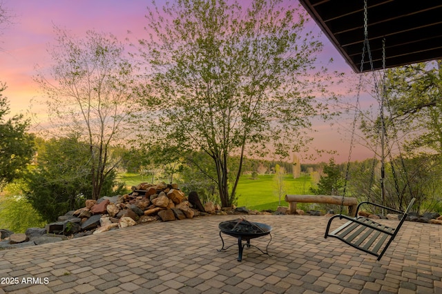 patio terrace at dusk with a fire pit