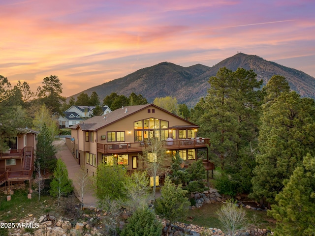 back of property featuring a mountain view