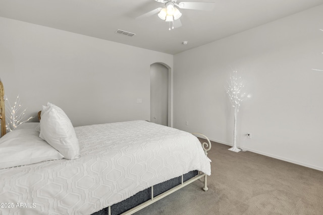 4279 N Spyglass Dr, Florence, AZ 85132 - carpeted bedroom with arched walkways, visible vents, and a ceiling fan