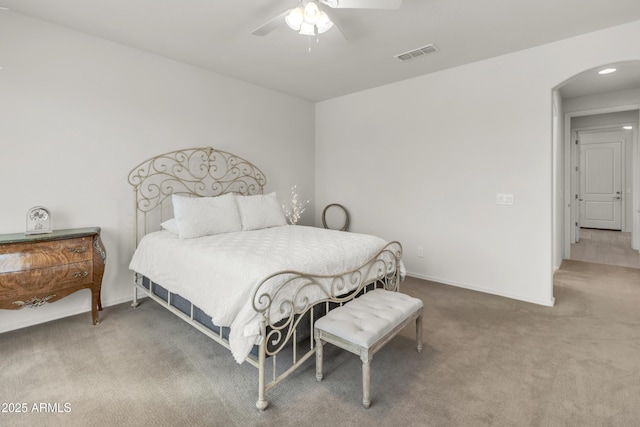 4279 N Spyglass Dr, Florence, AZ 85132 - bedroom featuring carpet flooring, visible vents, baseboards, arched walkways, and a ceiling fan