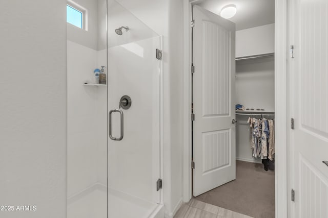 4279 N Spyglass Dr, Florence, AZ 85132 - bathroom featuring a walk in closet and a stall shower