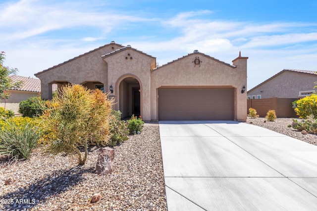 4279 N Spyglass Dr, Florence, AZ 85132 - view of front of home featuring driveway, fence, a tiled roof, stucco siding, and a garage