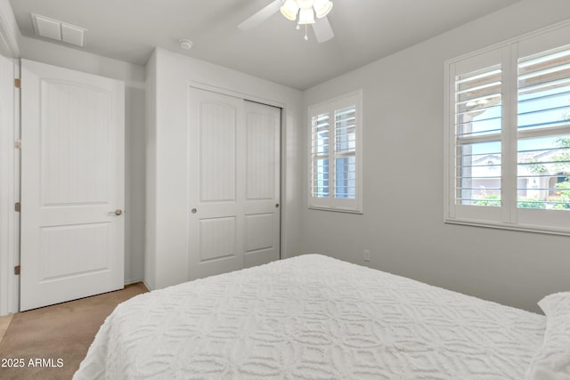 4279 N Spyglass Dr, Florence, AZ 85132 - carpeted bedroom with visible vents, a ceiling fan, multiple windows, and a closet