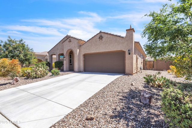 4279 N Spyglass Dr, Florence, AZ 85132 - view of front facade featuring a tiled roof, stucco siding, concrete driveway, and an attached garage