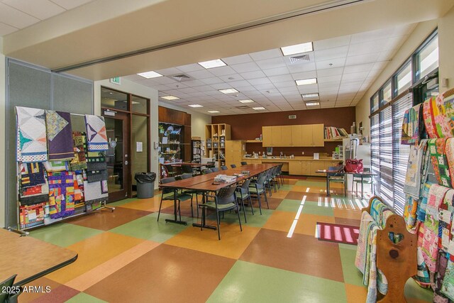 4279 N Spyglass Dr, Florence, AZ 85132 - recreation room with tile patterned floors, visible vents, and a paneled ceiling