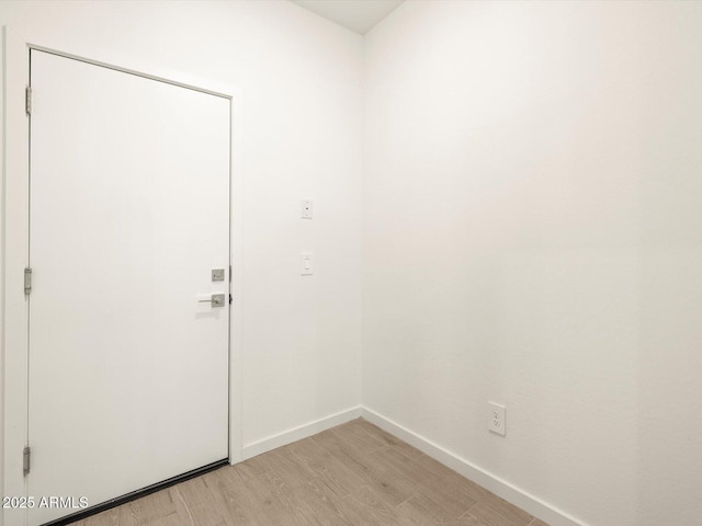 doorway with light hardwood / wood-style floors