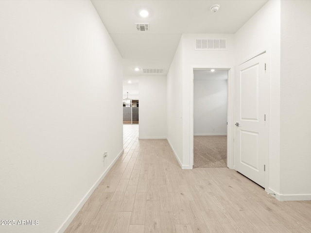 hallway with light wood-type flooring