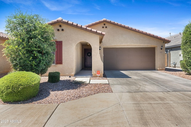 654 E Buckingham Ave, Gilbert, AZ 85297 - mediterranean / spanish-style home with stucco siding, an attached garage, driveway, and a tiled roof