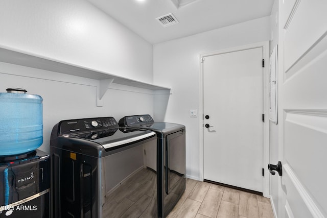 654 E Buckingham Ave, Gilbert, AZ 85297 - laundry area featuring independent washer and dryer and light wood-style flooring