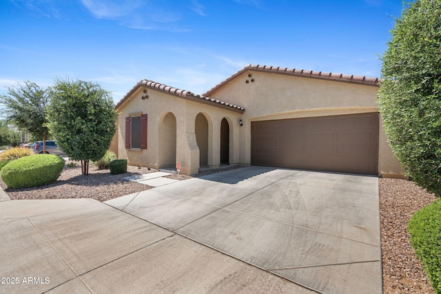 654 E Buckingham Ave, Gilbert, AZ 85297 - mediterranean / spanish-style house featuring driveway, stucco siding, and an attached garage