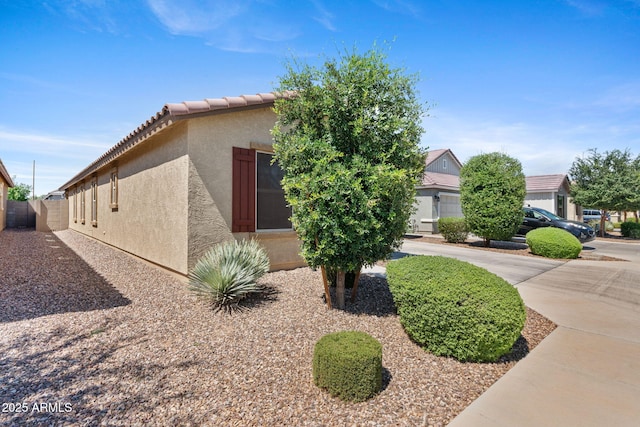 654 E Buckingham Ave, Gilbert, AZ 85297 - view of property exterior featuring stucco siding and a tiled roof