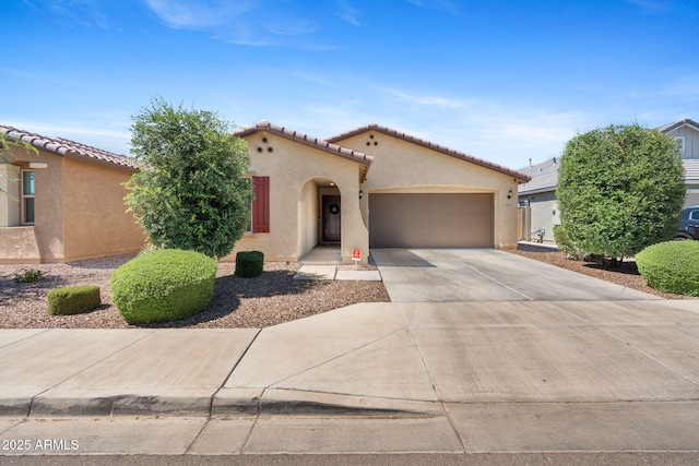 654 E Buckingham Ave, Gilbert, AZ 85297 - mediterranean / spanish house with an attached garage, stucco siding, driveway, and a tiled roof
