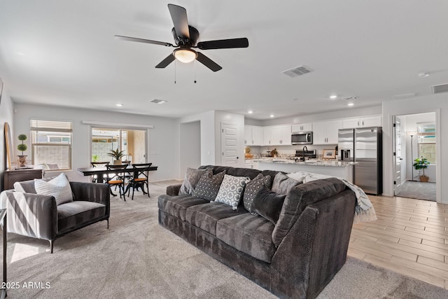 654 E Buckingham Ave, Gilbert, AZ 85297 - living room with recessed lighting, a ceiling fan, and light wood-type flooring