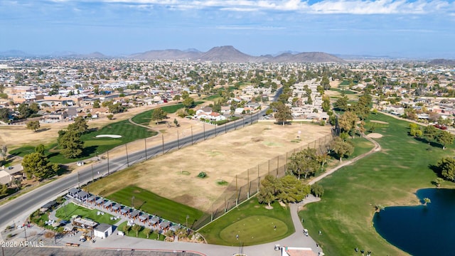 drone / aerial view with a water and mountain view