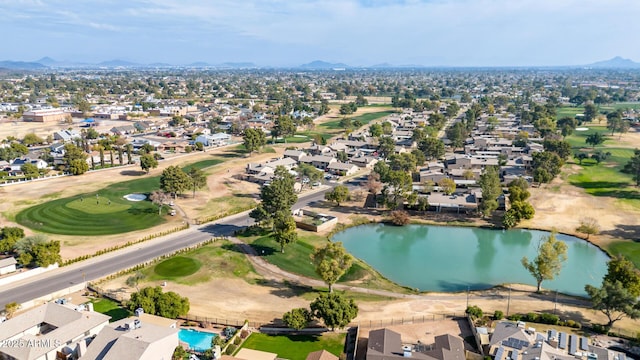 birds eye view of property with a water and mountain view