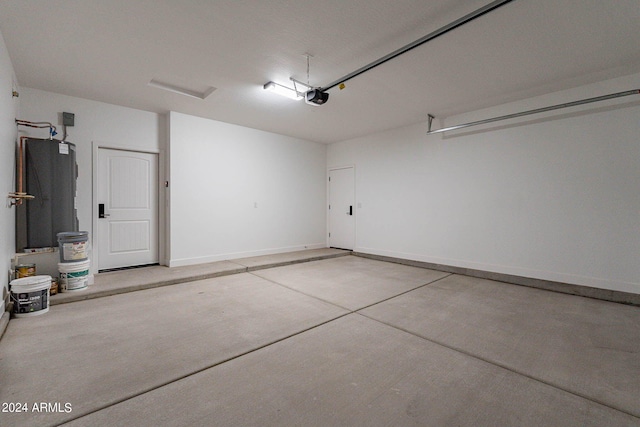 garage with a garage door opener and water heater