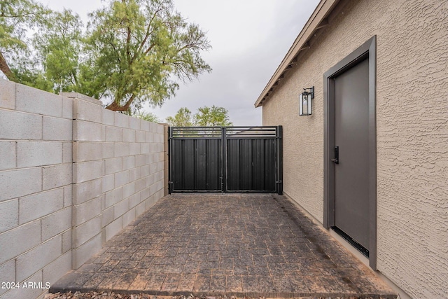 view of side of property with a patio area