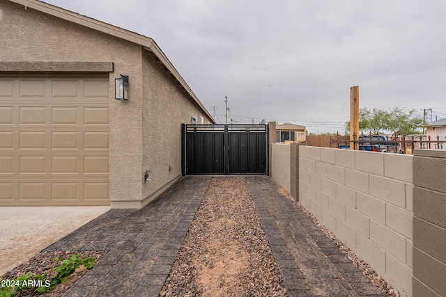 view of property exterior featuring a garage