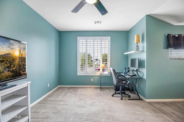 carpeted home office with ceiling fan