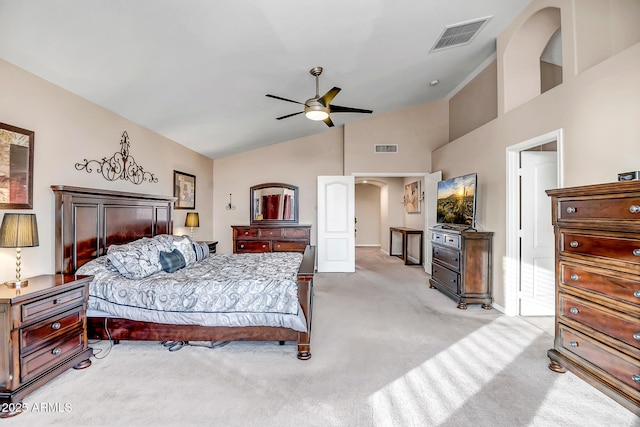 bedroom with high vaulted ceiling, ceiling fan, and light carpet