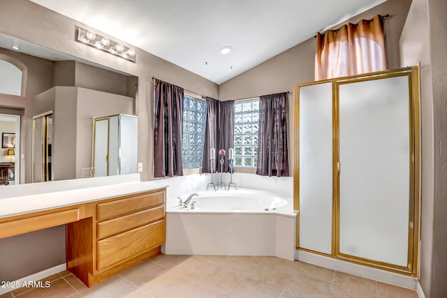 bathroom with lofted ceiling, shower with separate bathtub, vanity, and tile patterned floors