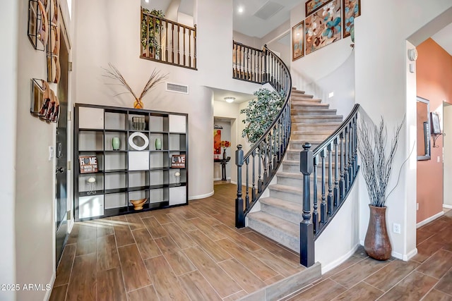 stairway with a towering ceiling