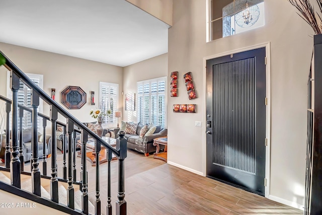 foyer entrance with hardwood / wood-style floors