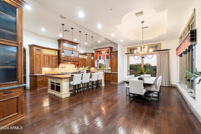 dining space featuring a chandelier and dark hardwood / wood-style floors