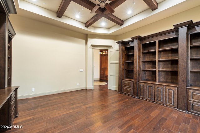 unfurnished living room with beamed ceiling, dark hardwood / wood-style floors, ceiling fan, and coffered ceiling