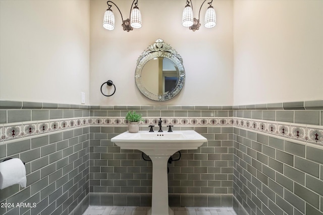 bathroom with tile walls