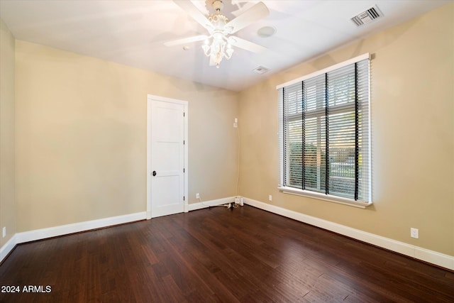 unfurnished room with a wealth of natural light, hardwood / wood-style floors, and ceiling fan