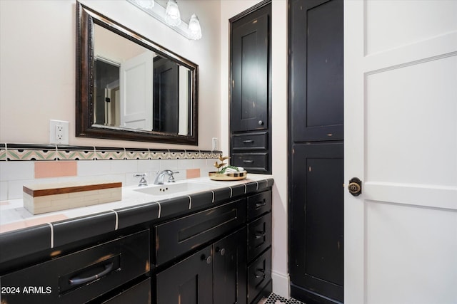 bathroom with vanity and backsplash