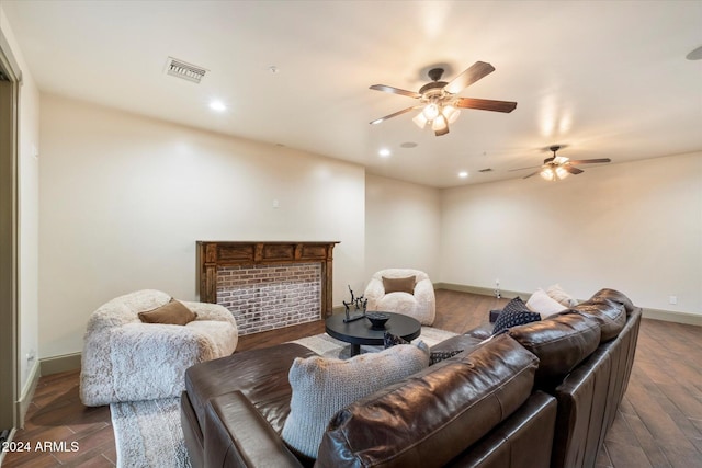 living room with ceiling fan and dark wood-type flooring