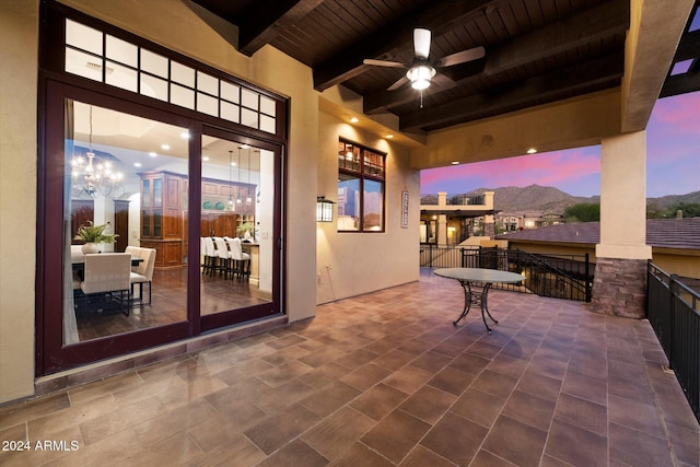 patio terrace at dusk with ceiling fan