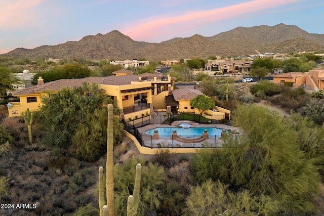 aerial view at dusk with a mountain view