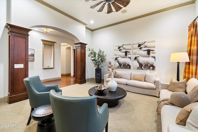 living room with ornate columns and crown molding