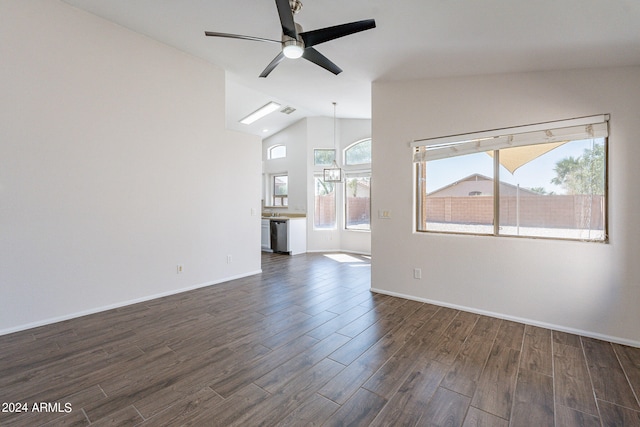 spare room with lofted ceiling, ceiling fan, and dark hardwood / wood-style flooring