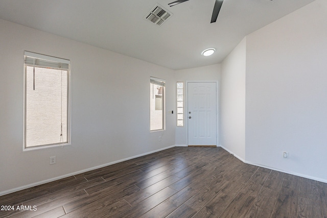 entryway featuring ceiling fan, dark wood-type flooring, and a wealth of natural light